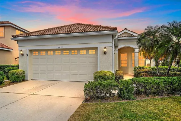 a front view of a house with a garage
