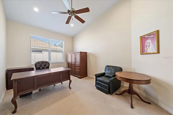 a bedroom with furniture and a window