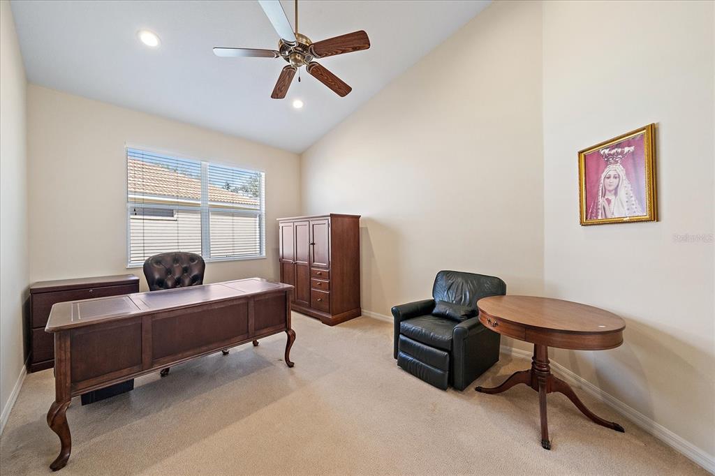 6476 Rookery Circle Bradenton, FL 34203 - Photo 14 of 44 a bedroom with furniture and a window