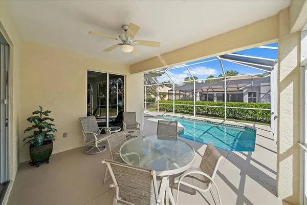 a view of a house and a patio with swimming pool
