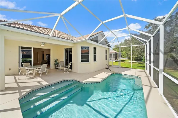 a view of a house with backyard porch and patio
