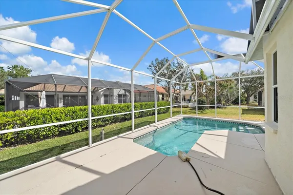 a view of a swimming pool with a patio