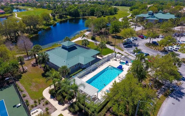 an aerial view of a house with a lake view