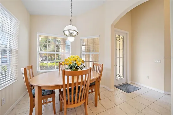 a view of a dining room with furniture and window