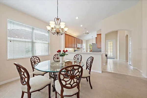 a dining room with furniture and window