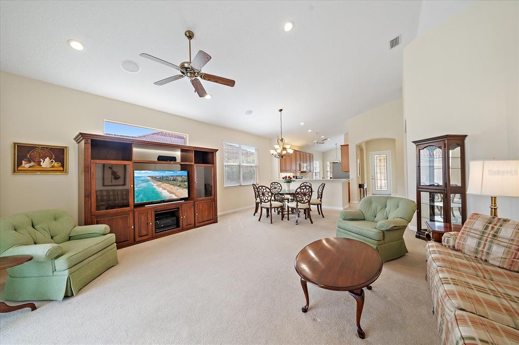 6476 Rookery Circle Bradenton, FL 34203 - Photo 10 of 44 a living room with furniture and a flat screen tv