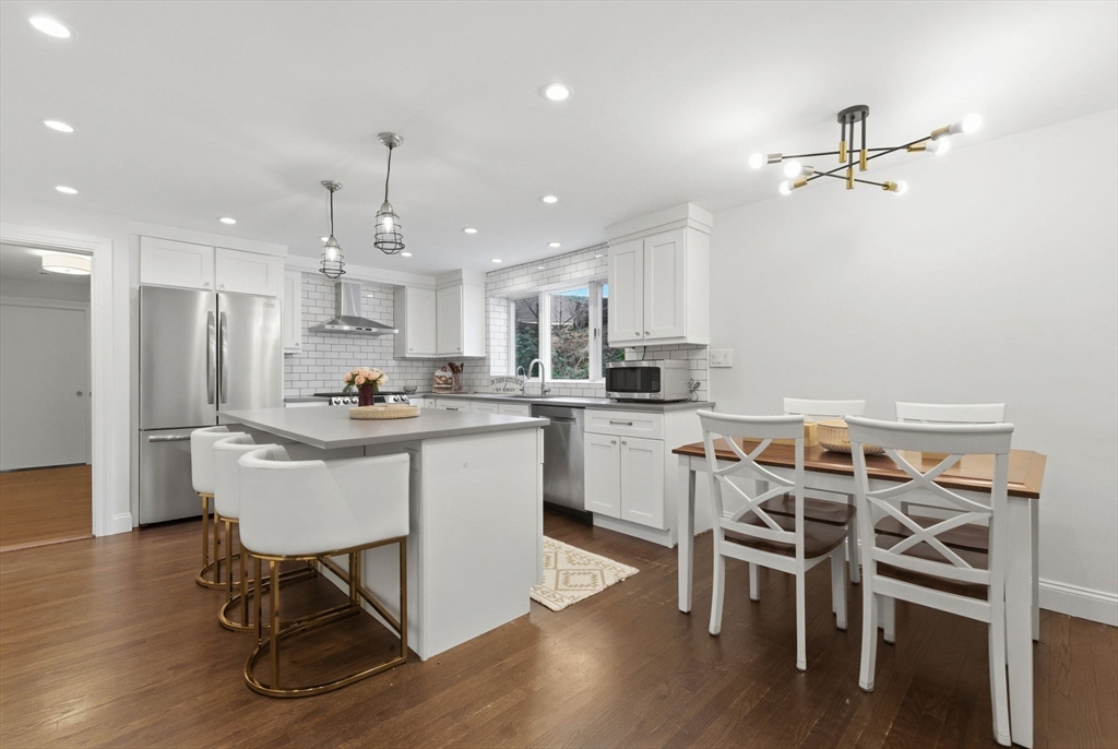 30 Allandale Street Boston, MA 02130 - Photo 1 of 33 a kitchen with kitchen island white cabinets and stainless steel appliances