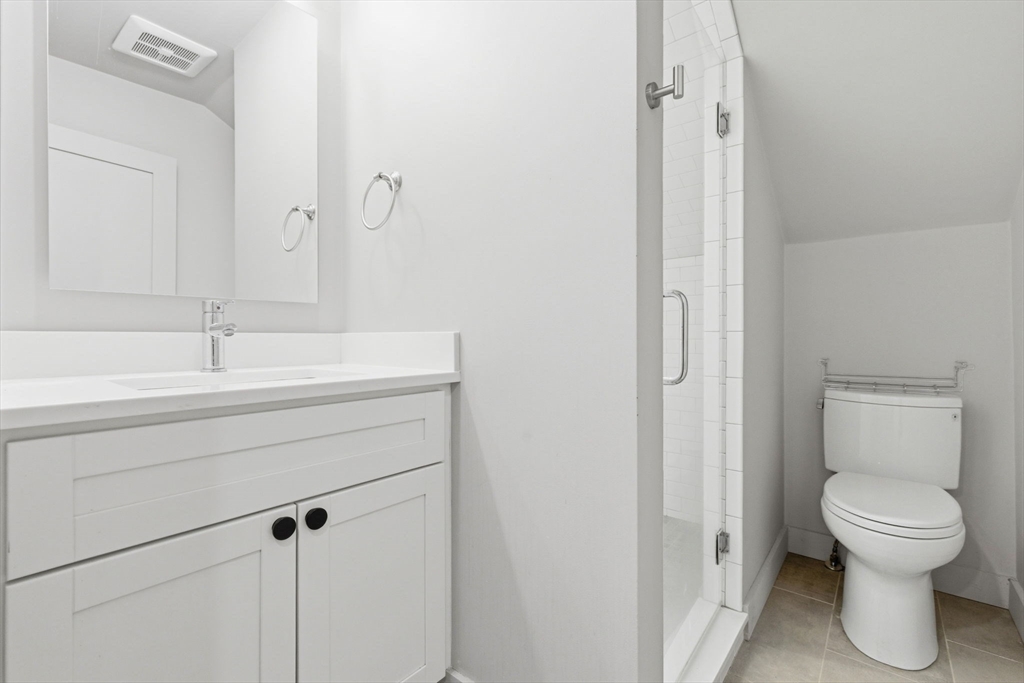30 Allandale Street Boston, MA 02130 - Photo 20 of 33 a bathroom with a sink toilet and a mirror