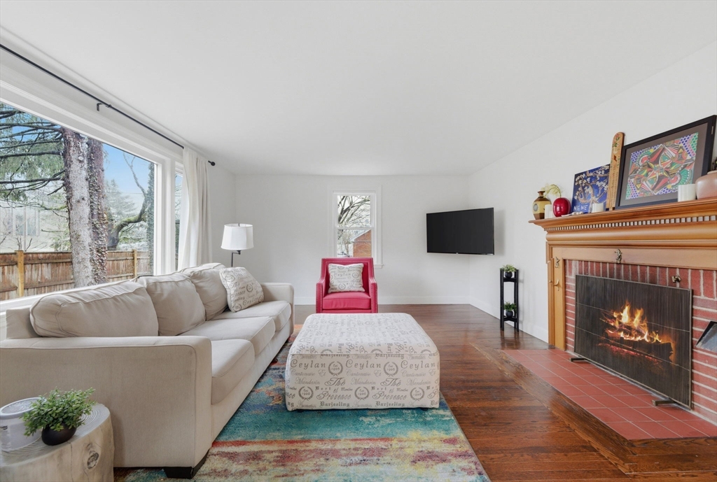 30 Allandale Street Boston, MA 02130 - Photo 8 of 33 a living room with furniture fireplace and window