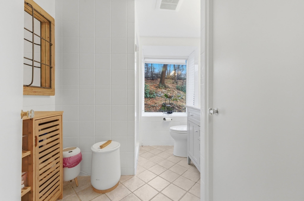 30 Allandale Street Boston, MA 02130 - Photo 9 of 33 a bathroom with a toilet and a shower curtain