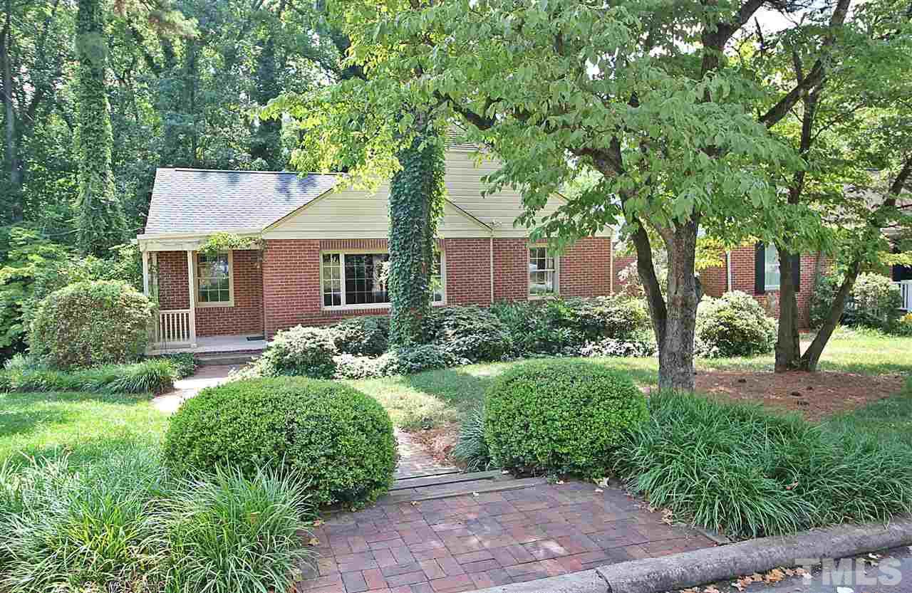 1204 Mitchell Street Raleigh, NC 27607 - Photo 1 of 22 a front view of a house with a yard and green space
