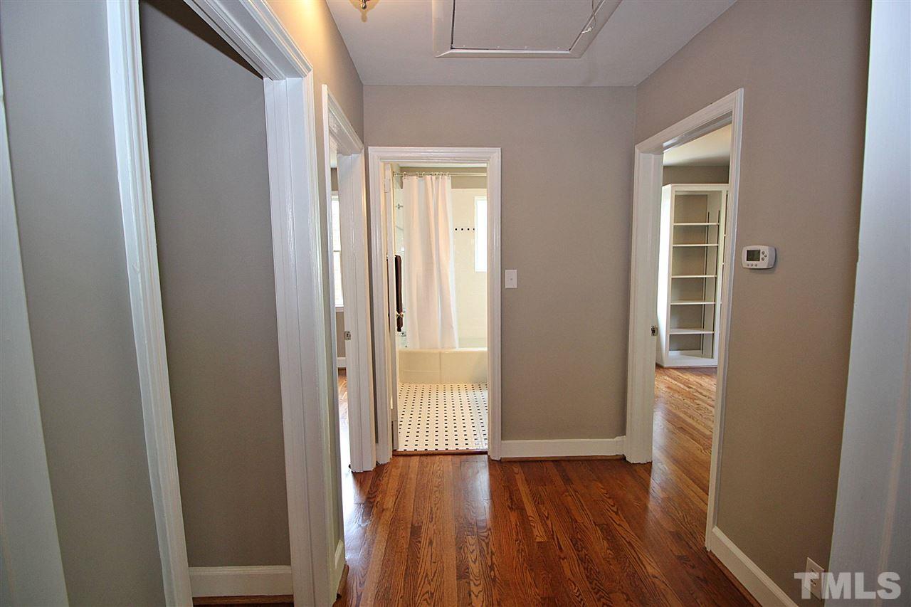 1204 Mitchell Street Raleigh, NC 27607 - Photo 13 of 22 a view of hallway with wooden floor