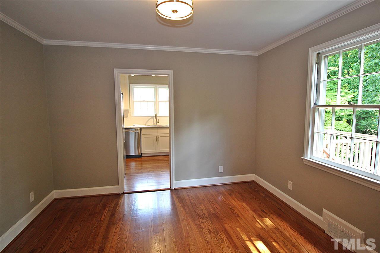 1204 Mitchell Street Raleigh, NC 27607 - Photo 14 of 22 a view of empty room with wooden floor and fan