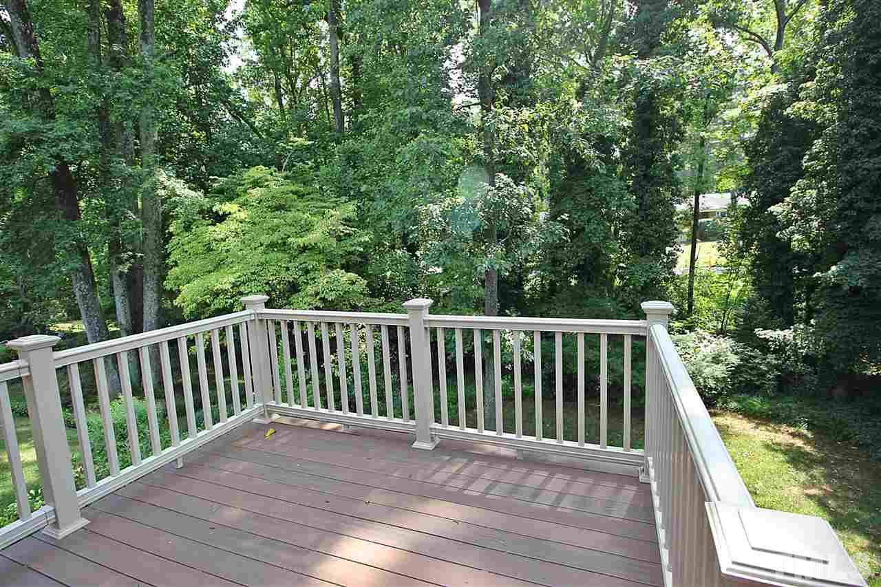 1204 Mitchell Street Raleigh, NC 27607 - Photo 18 of 22 a view of balcony with wooden floor and fence