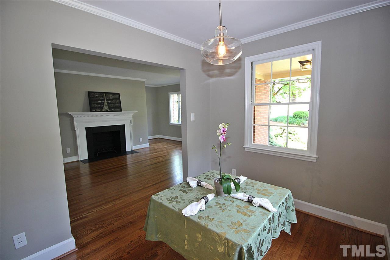 1204 Mitchell Street Raleigh, NC 27607 - Photo 6 of 22 a view of a dining room with furniture window and wooden floor