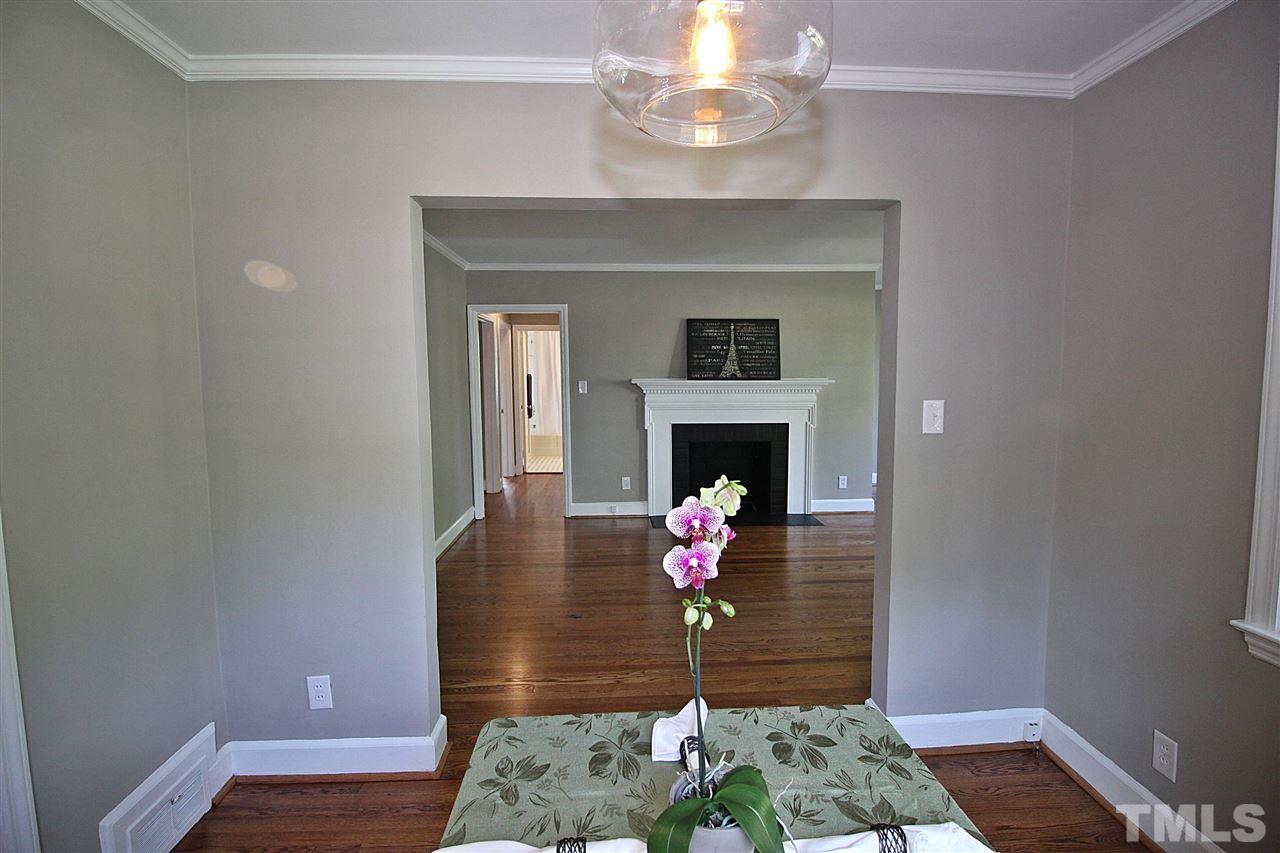 1204 Mitchell Street Raleigh, NC 27607 - Photo 7 of 22 a living room with furniture and a fireplace