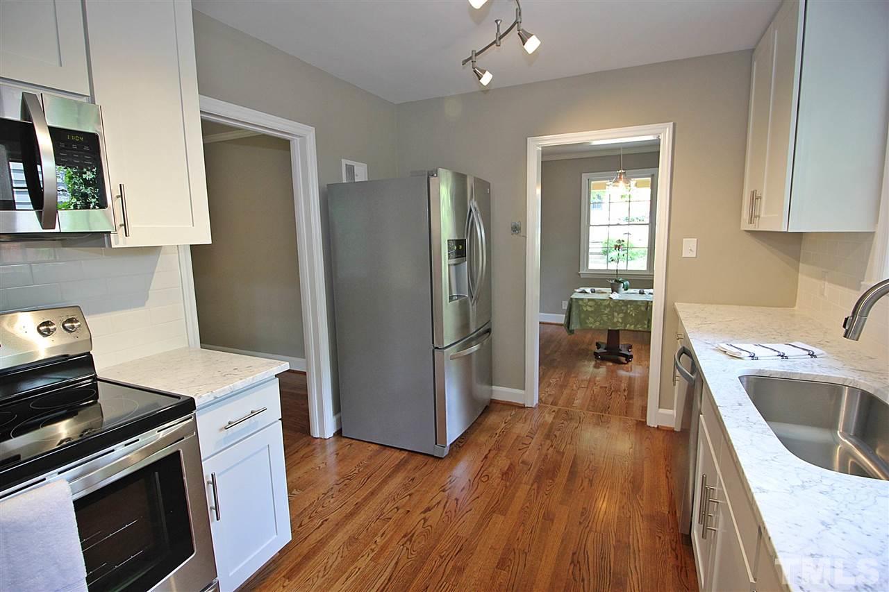 1204 Mitchell Street Raleigh, NC 27607 - Photo 10 of 22 a kitchen with a sink stove and refrigerator