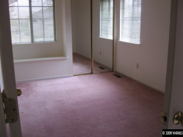 5950 Walnut Creek Road Reno, NV 89523 - Photo 5 of 7 an empty room with windows