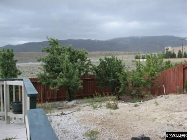 5950 Walnut Creek Road Reno, NV 89523 - Photo 7 of 7 a view of a backyard with plants and large trees