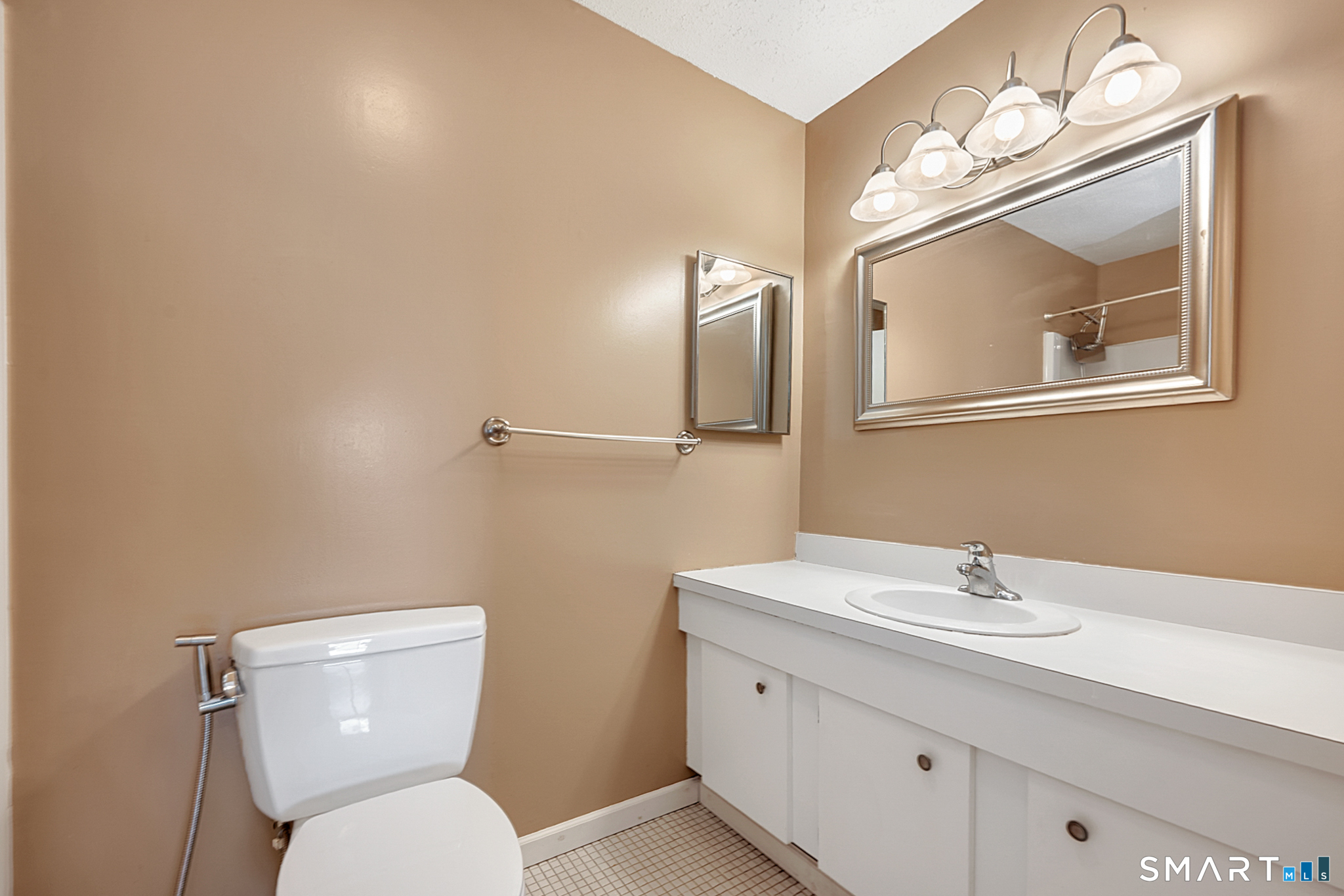 160 Brittany Farms Road, Unit F New Britain, CT 06053 - Photo 23 of 35 a bathroom with a toilet a sink and mirror