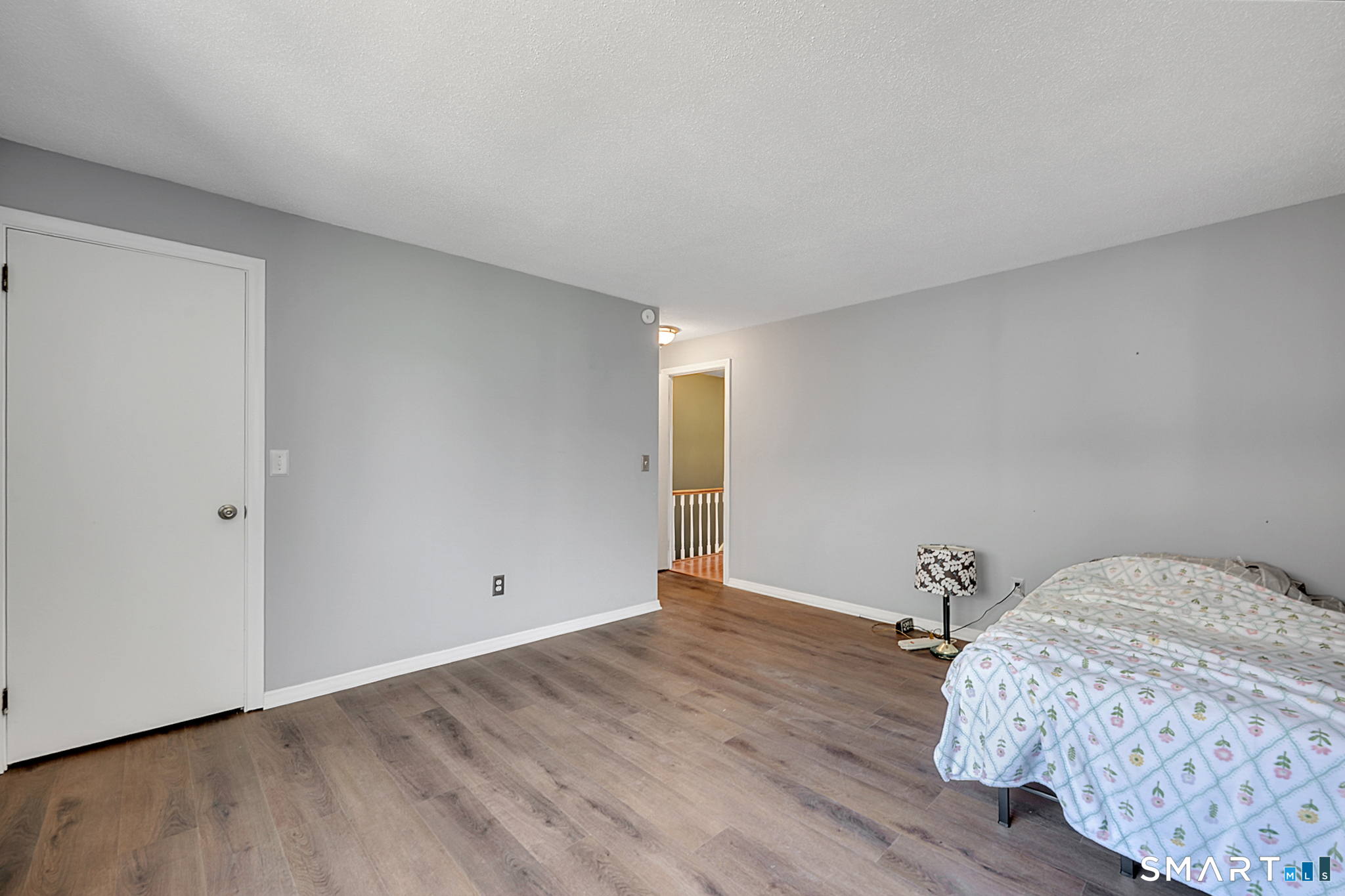 160 Brittany Farms Road, Unit F New Britain, CT 06053 - Photo 24 of 35 a view of bedroom with wooden floor