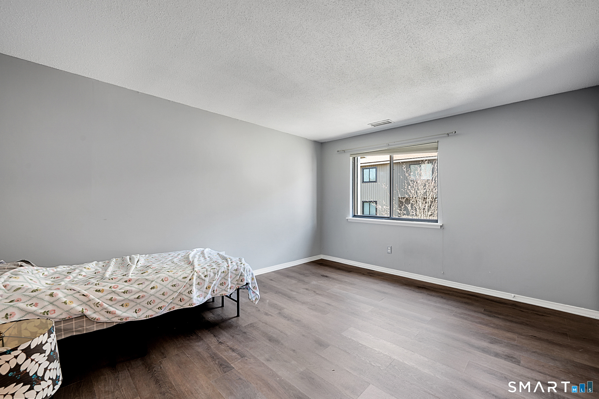 160 Brittany Farms Road, Unit F New Britain, CT 06053 - Photo 25 of 35 a bedroom with bed and a window