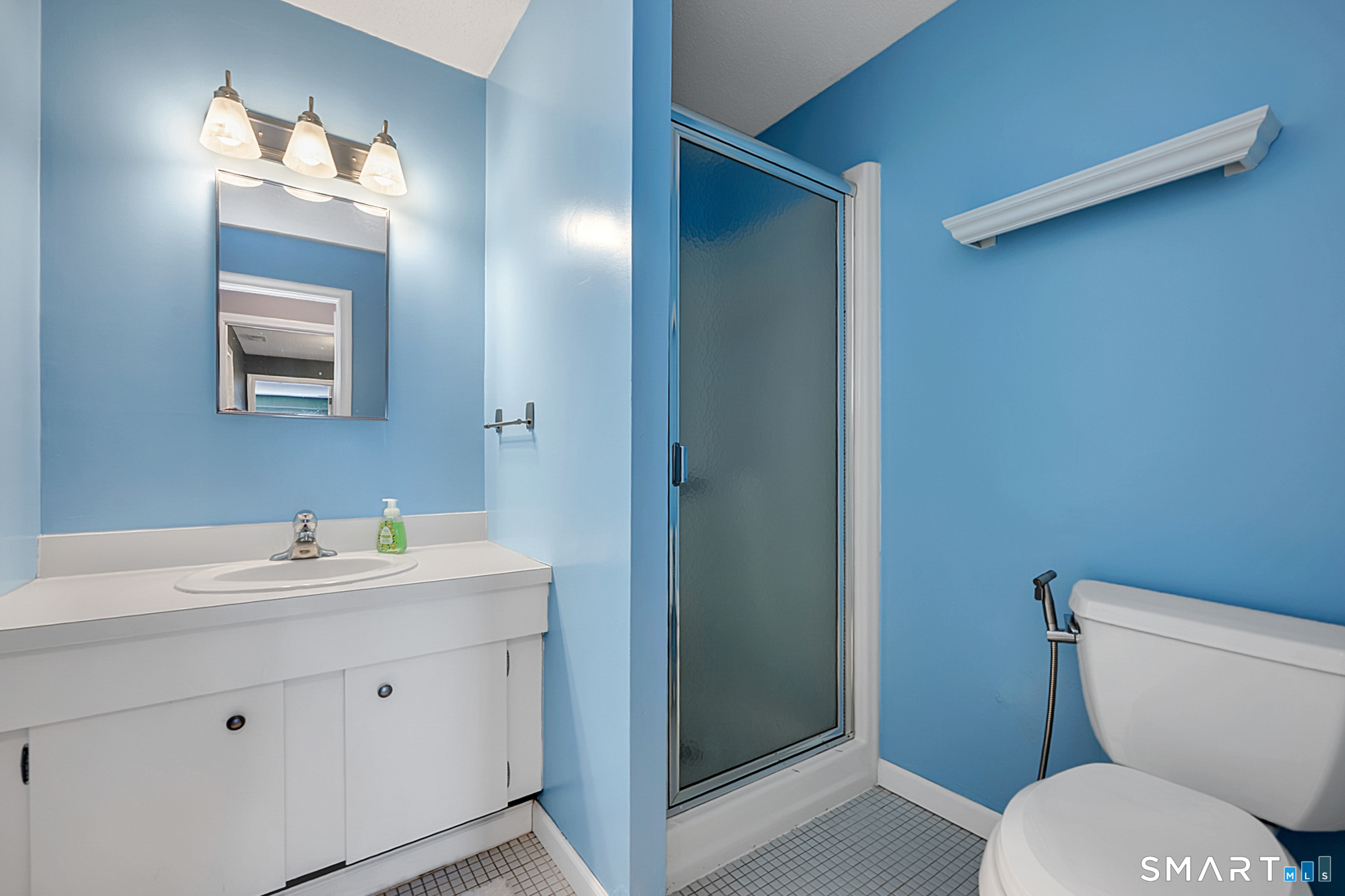 160 Brittany Farms Road, Unit F New Britain, CT 06053 - Photo 27 of 35 a bathroom with a toilet sink and mirror