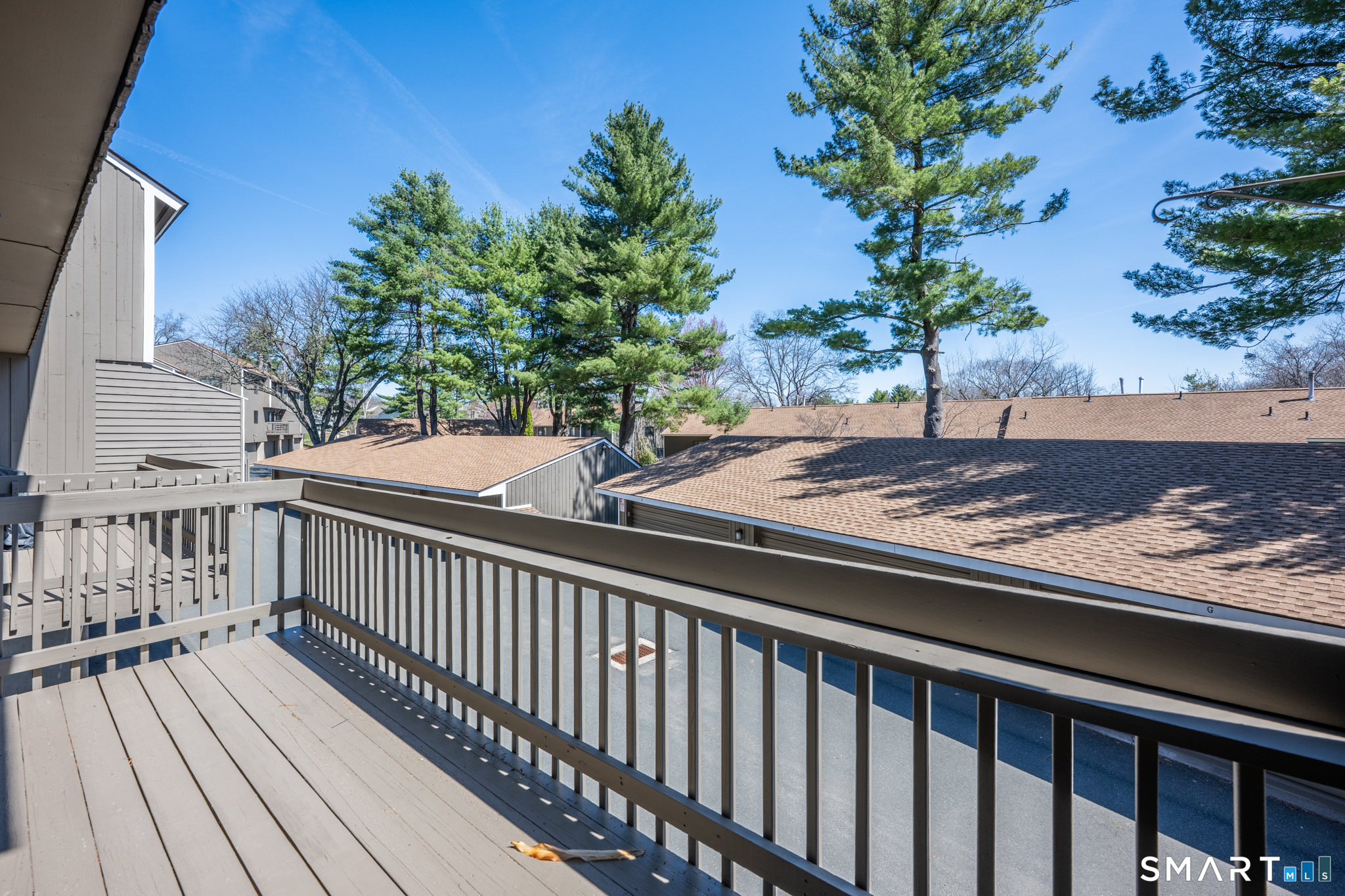 160 Brittany Farms Road, Unit F New Britain, CT 06053 - Photo 31 of 35 a view of a wooden deck and a yard