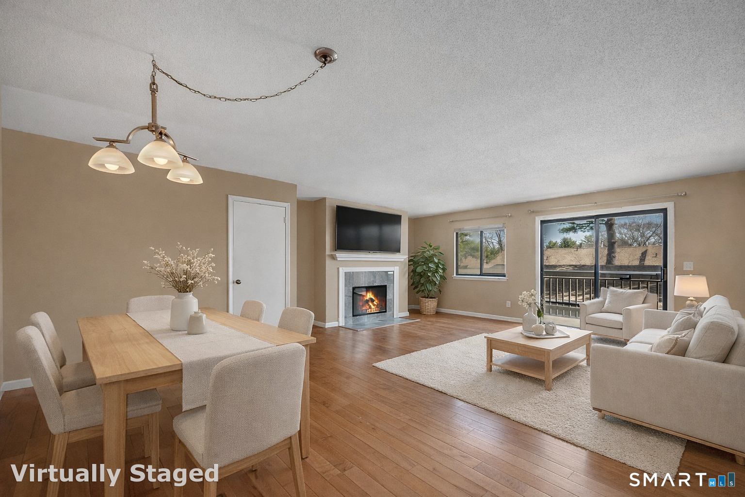 160 Brittany Farms Road, Unit F New Britain, CT 06053 - Photo 6 of 35 a living room with fireplace furniture and a wooden floor