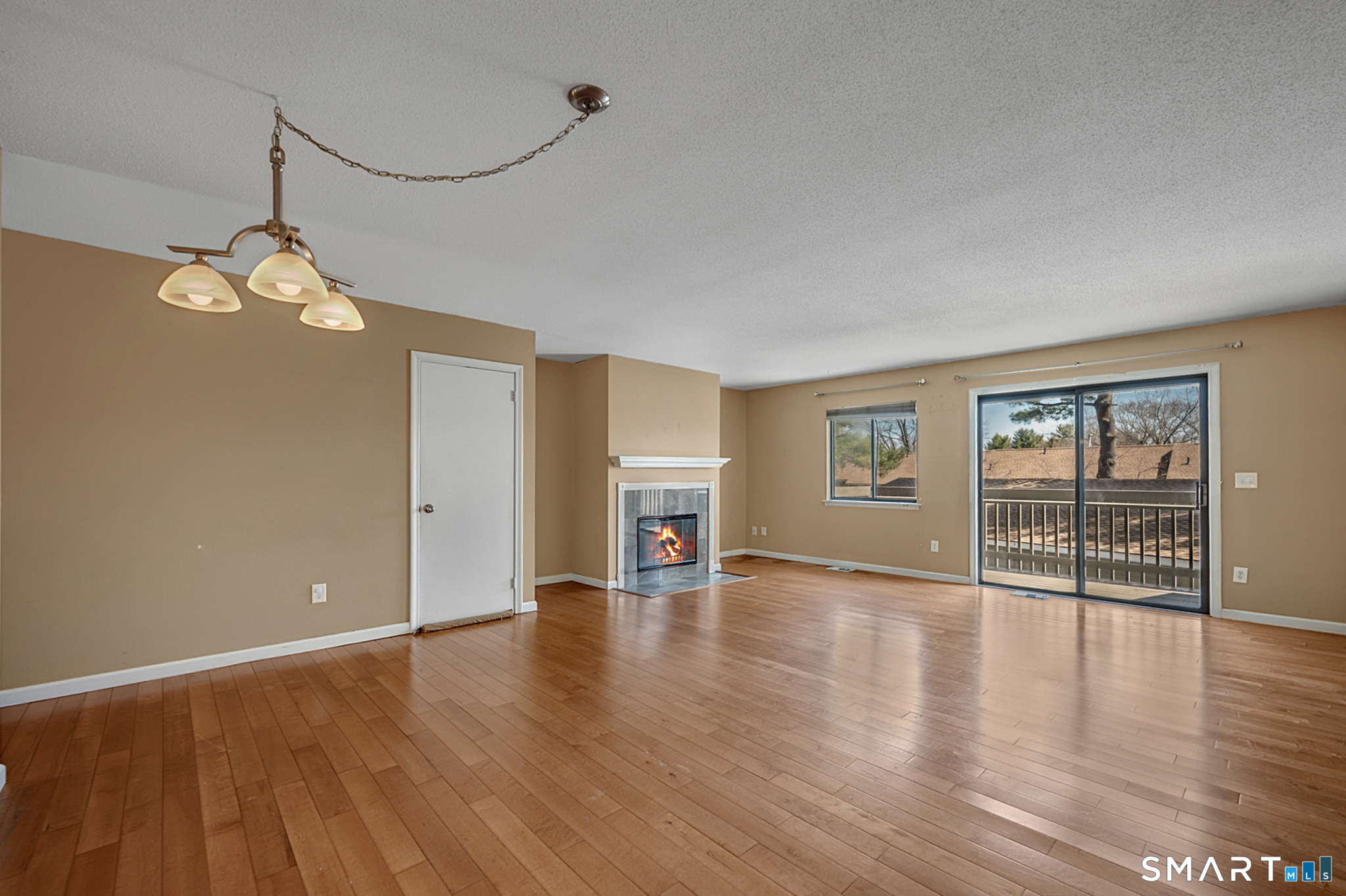 160 Brittany Farms Road, Unit F New Britain, CT 06053 - Photo 7 of 35 a view of empty room with wooden floor