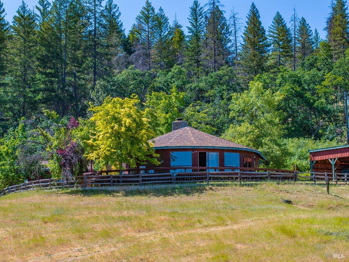 125 Cedar Gulch Road Hayfork, CA 96041 - Photo 17 of 57 a house view with swimming pool and wooden fence