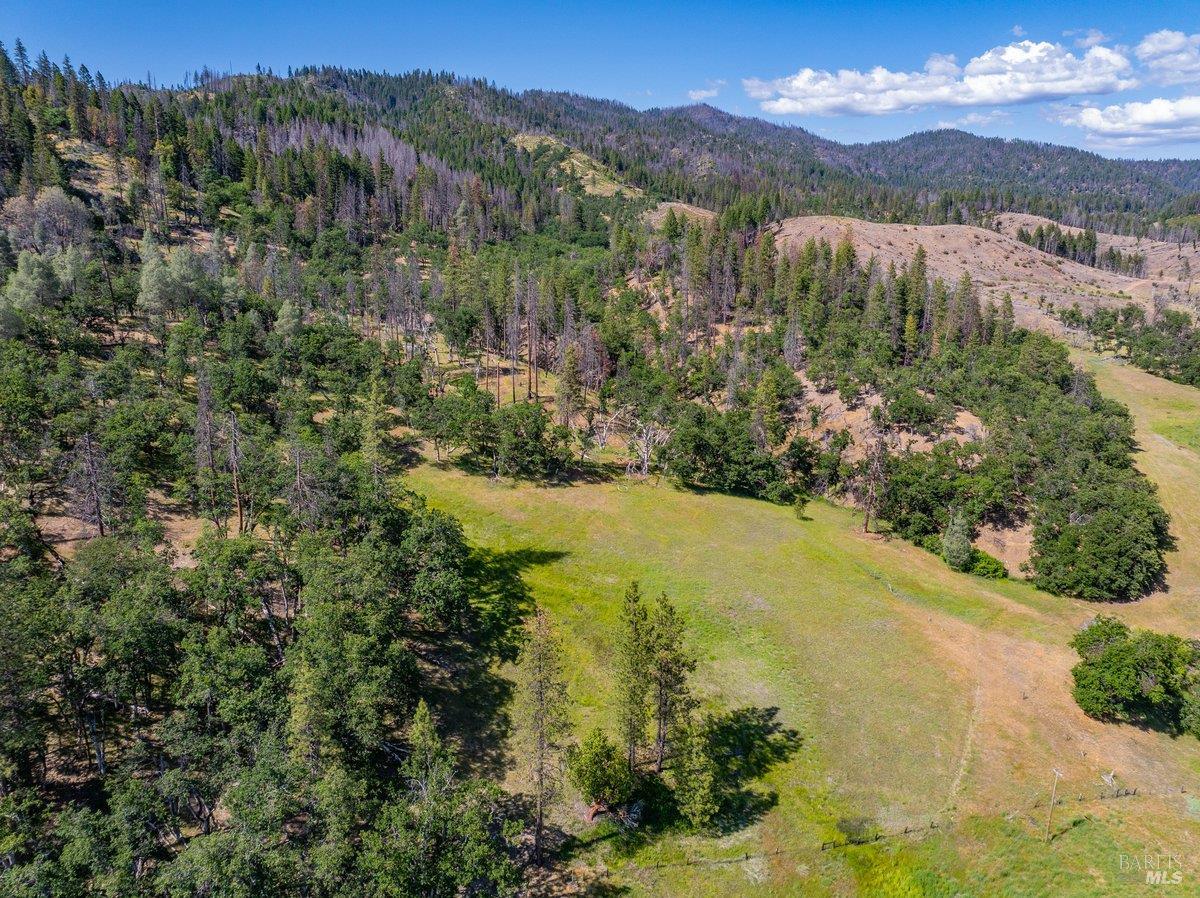 125 Cedar Gulch Road Hayfork, CA 96041 - Photo 21 of 57 a view of a lake with mountains in the background