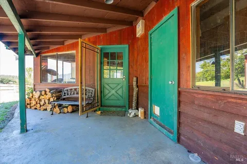 a patio with patio couch and chairs