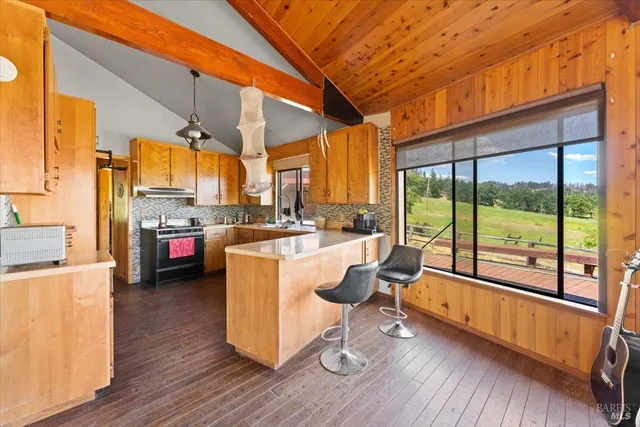 a view of a wooden house with a outdoor space