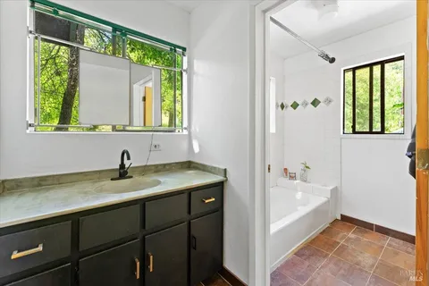a view of empty room with ceiling fan