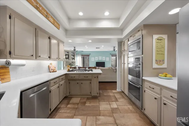 a kitchen with a sink and a large window