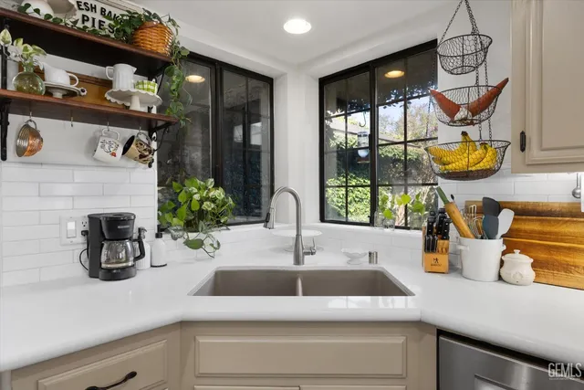 a kitchen with a refrigerator and countertop