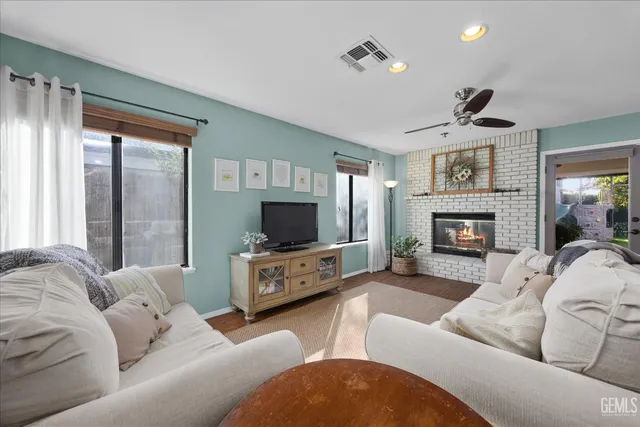 a living room with furniture and a fireplace