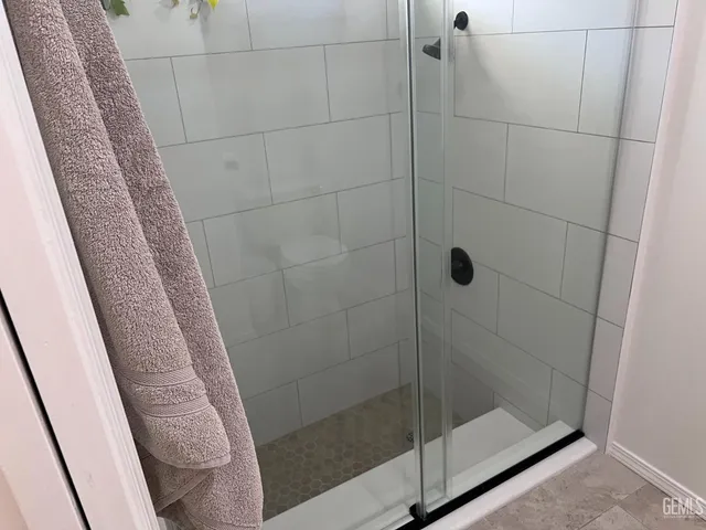 a view of a livingroom with workspace and a window