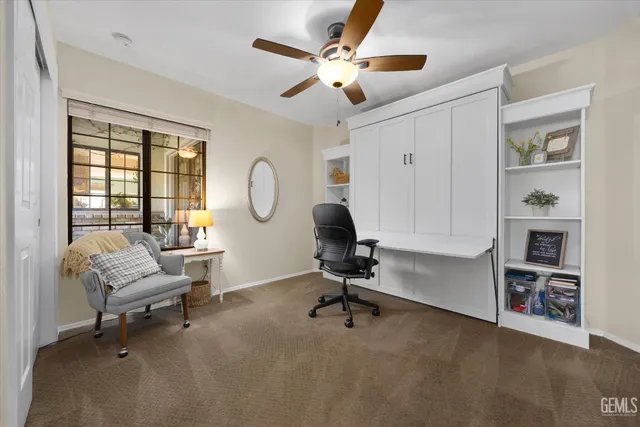 a living room with furniture and white walls
