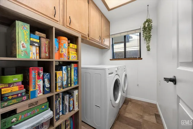 a view of a patio with a table chairs and a yard