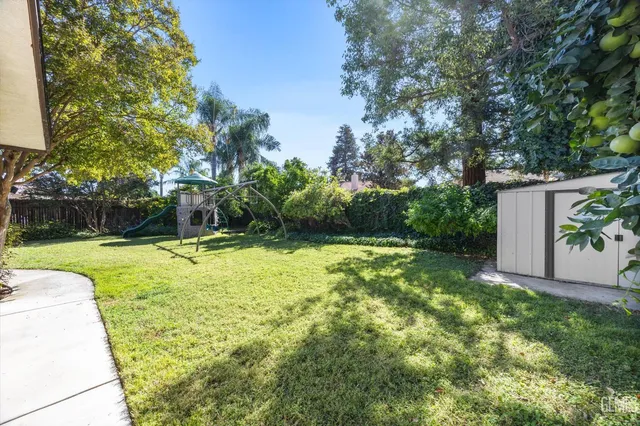 a view of a patio with a backyard