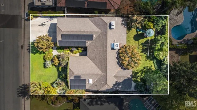 an aerial view of residential house with outdoor space