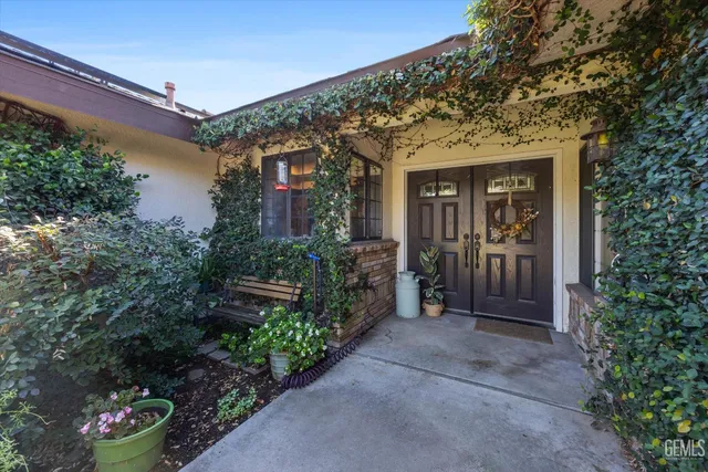a view of living room kitchen and entryway
