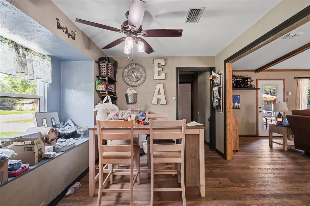124 Lou Street Sulphur Springs, TX 75482 - Photo 12 of 33 a view of a dining room with furniture window and wooden floor
