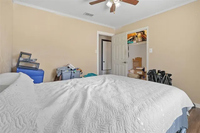 a bed room with a bed and a chandelier