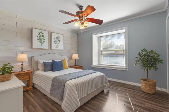 a bedroom with bed and window