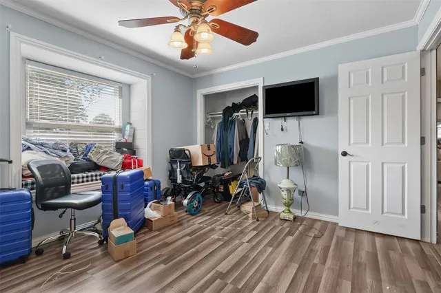 a view of a livingroom with furniture and a flat screen tv