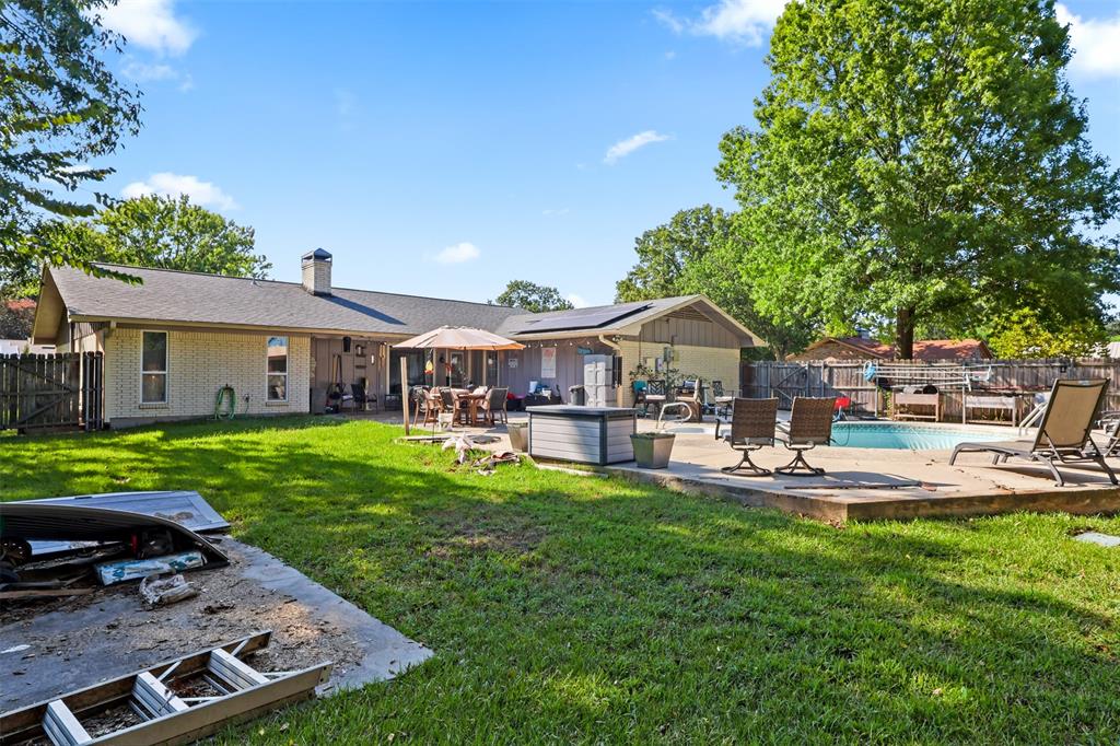 124 Lou Street Sulphur Springs, TX 75482 - Photo 31 of 33 a front view of a house with garden and patio