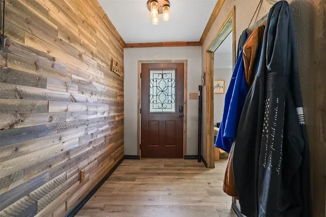 a view of hallway with wooden floor